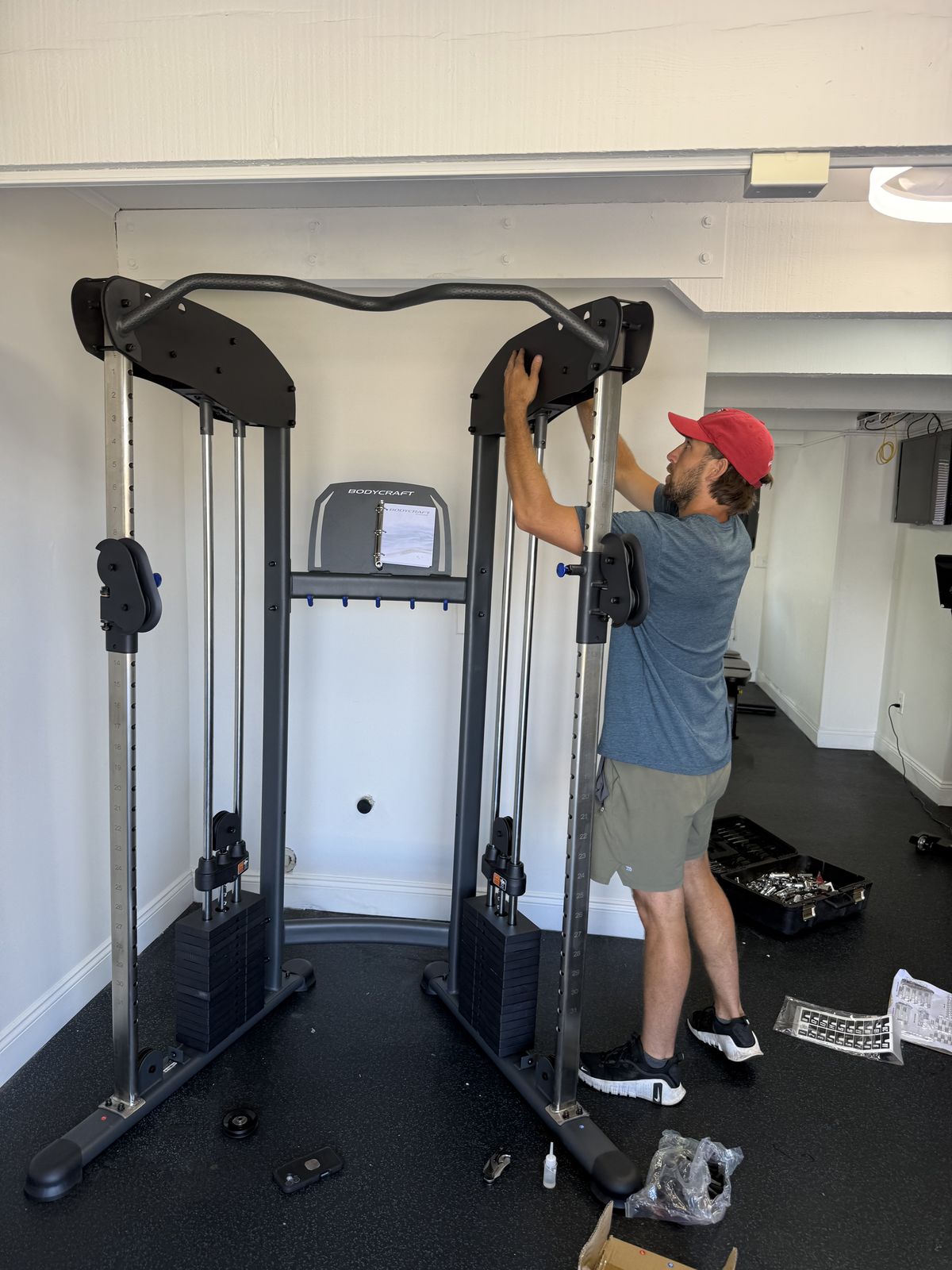 Installing a BodyCraft functional trainer in a client's gym
