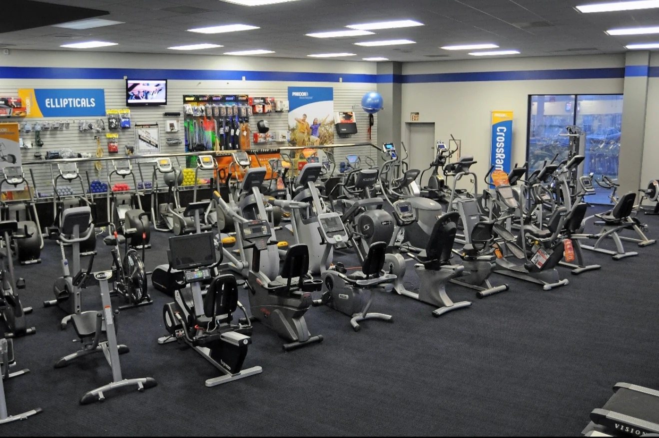 Showroom floor lined with commercial cardio equipment